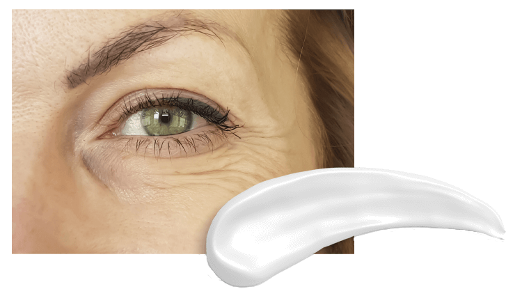 Close-up of woman's eye with a eye cream to the right