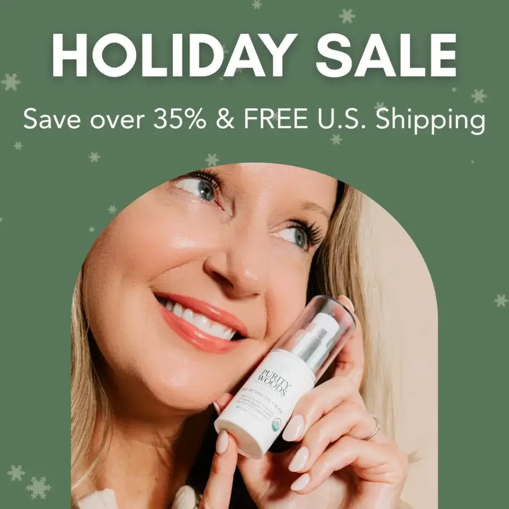 A person smiles while holding a skincare product labeled "Purity Woods" against a green background with snowflake graphics. Promotional text at the top reads: "HOLIDAY SALE – Save over 35% & FREE U.S. Shipping," highlighting a festive seasonal discount on beauty products.